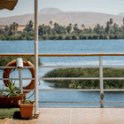 Scenic view from a river cruise deck in Egypt, showcasing the beautiful landscapes organized by DMC Egypt.