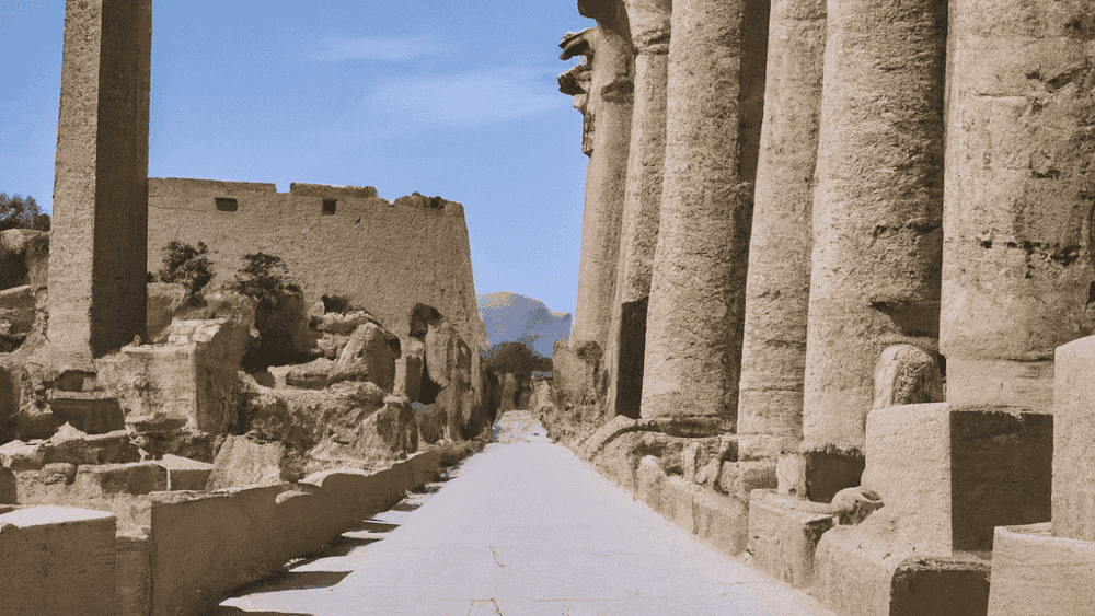Ancient Egyptian temple ruins with obelisk and columns.